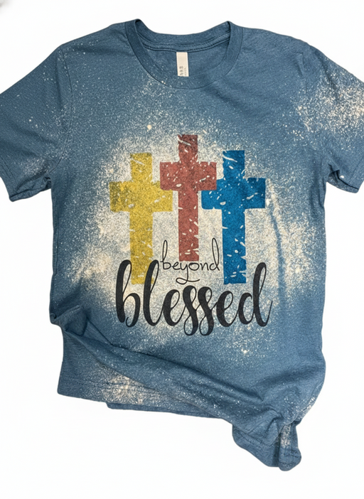 Blue t-shirt with colorful crosses and 'blessed' text on a white background