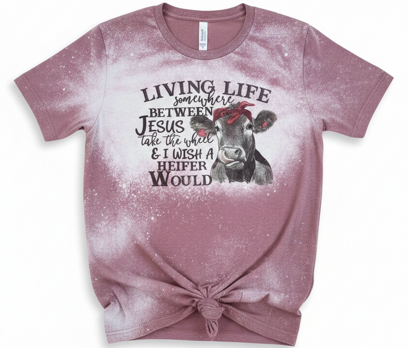 Pink t-shirt with a cow graphic and text on a white background