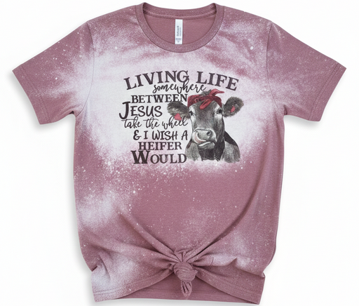 Pink t-shirt with a cow graphic and text on a white background