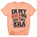 Peach t-shirt with graphic text and lightning bolt design on a white background