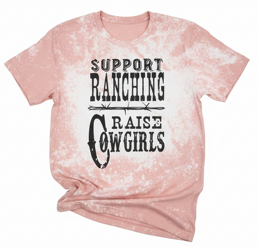 Pink tie-dye t-shirt with text 'Support Ranching Raise Cowgirls' on a white background